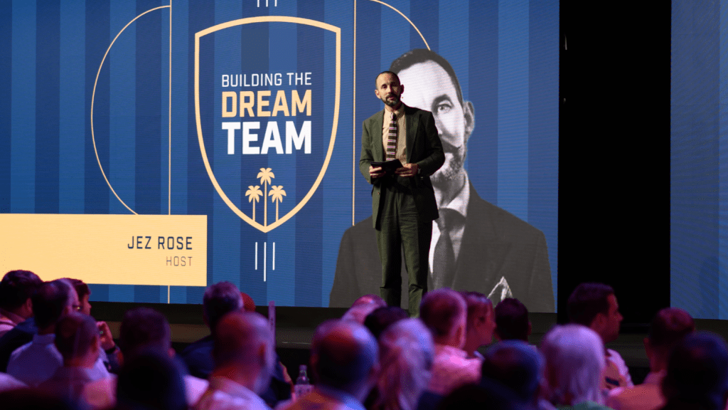 event conference host on branded stage