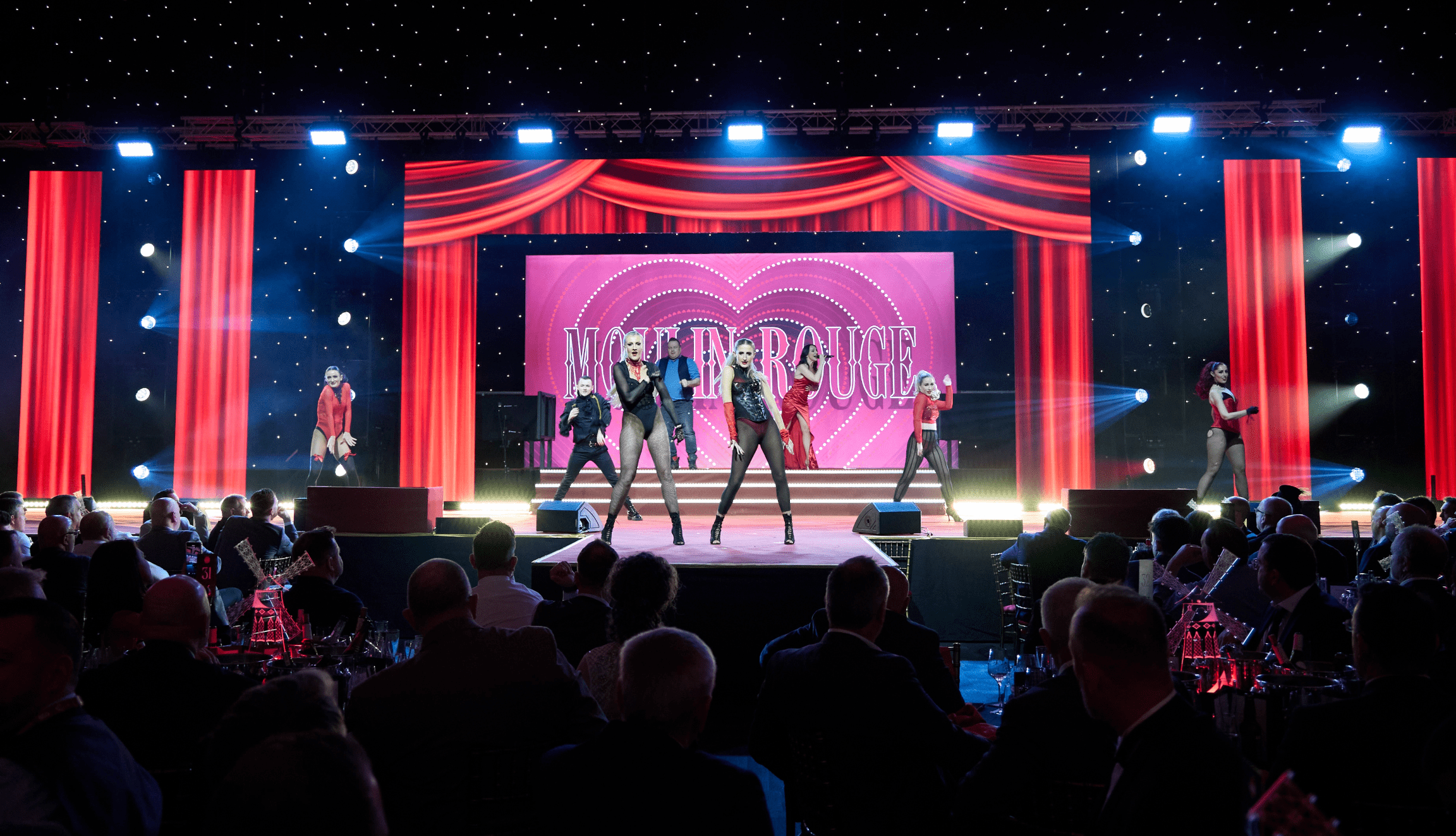 event stage moulin rouge themed with performers
