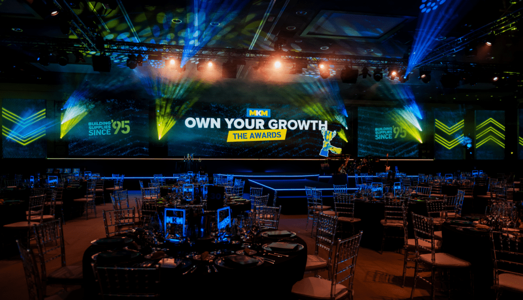 Strategic immersive leadership conference delivered by event agency with bold stage design, keynote speakers gala awards dinner.