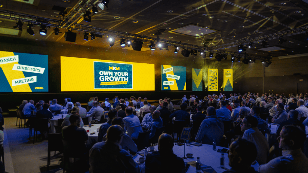 Strategic immersive leadership conference delivered by event agency with bold stage design, keynote speakers gala awards dinner.