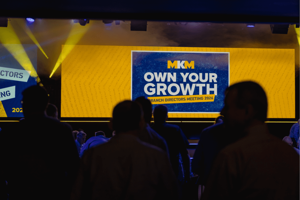 Strategic immersive leadership conference delivered by event agency with bold stage design, keynote speakers gala awards dinner.