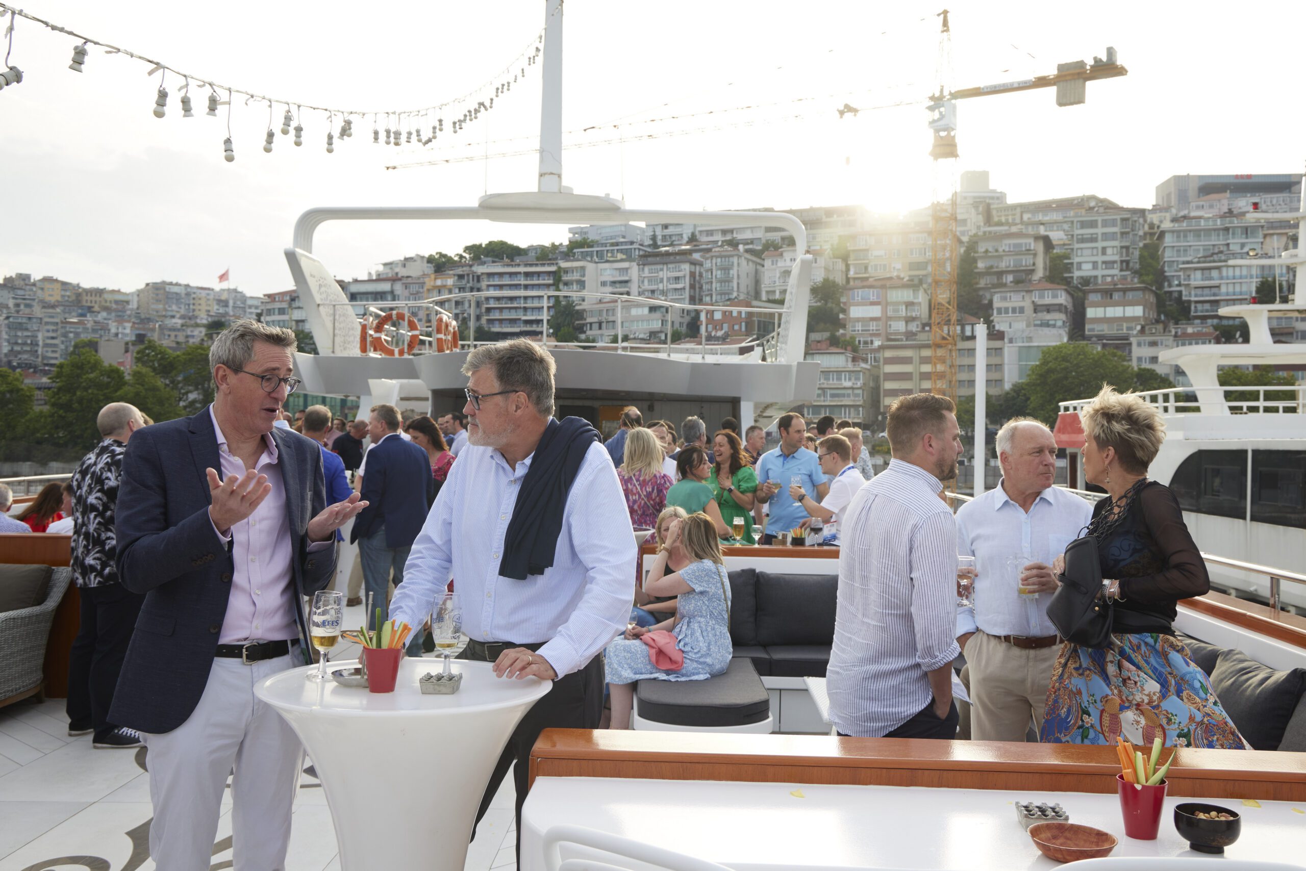 Event attendees enjoying a boat experience while building connections at a sustainable overseas event.