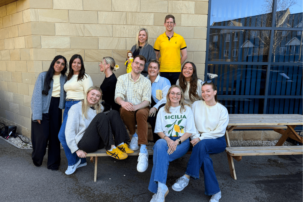 First Event team showing support for Endometriosis Awareness Month, wearing yellow and displaying office signs promoting awareness and solidarity.